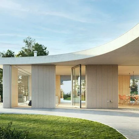 Curved-roof house with a Schüco AD AL 75 pivot door on the garden elevation