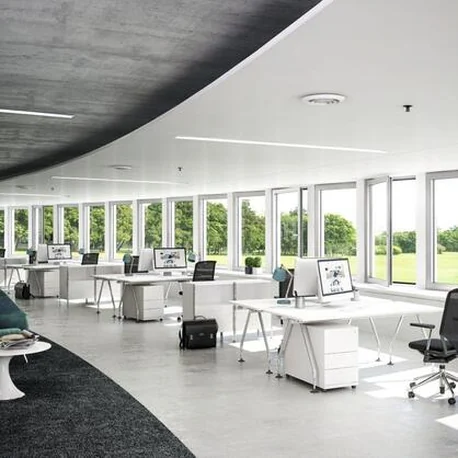 Open-plan office interior with a continuous ribbon of Schüco AWS 75.SI+ windows