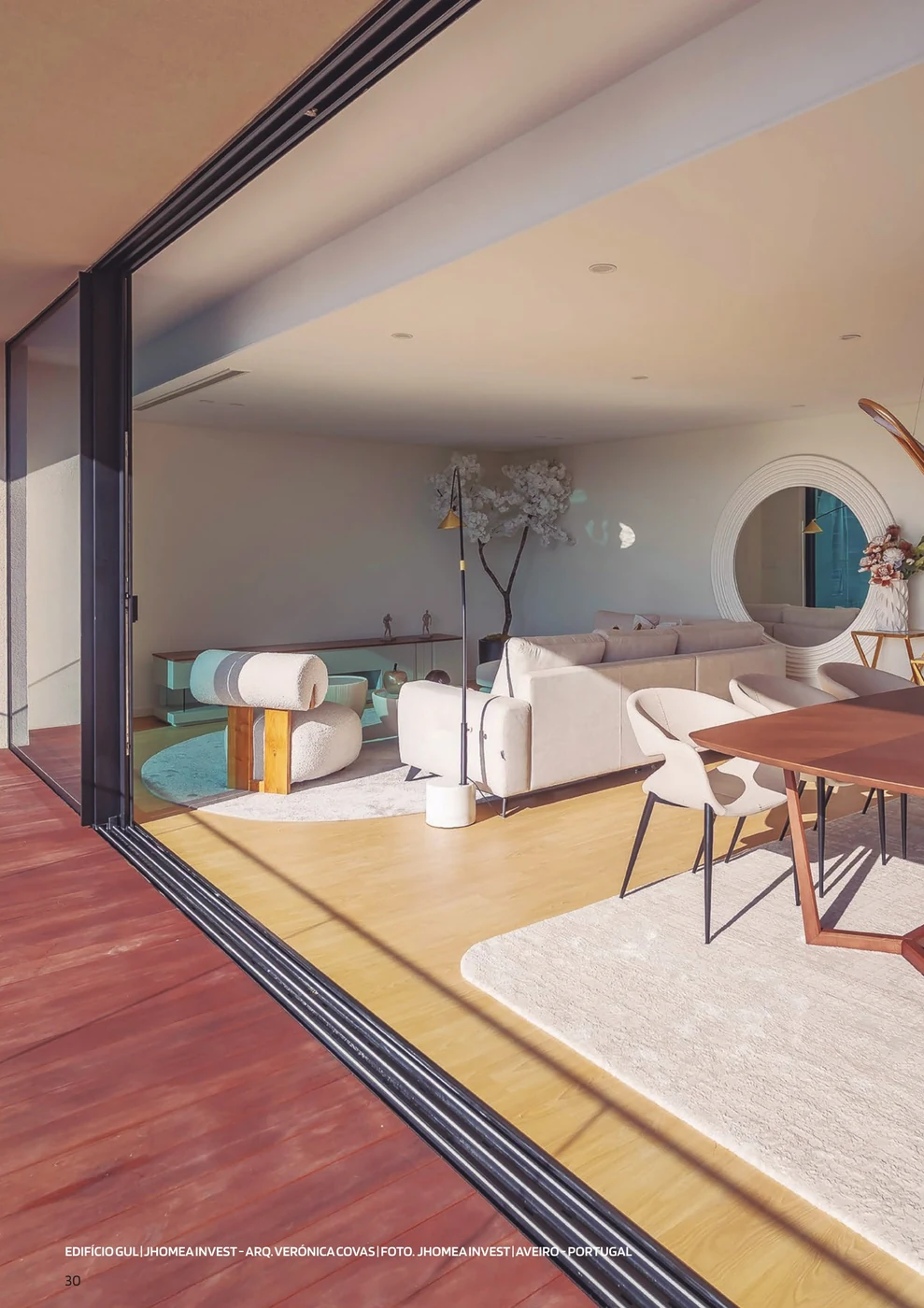Edificio GUL, Aveiro — a living interior opening to the balcony through a Sosoares JT sliding wall