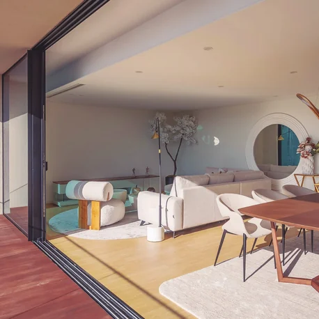 Edificio GUL, Aveiro — a living interior opening to the balcony through a Sosoares JT sliding wall