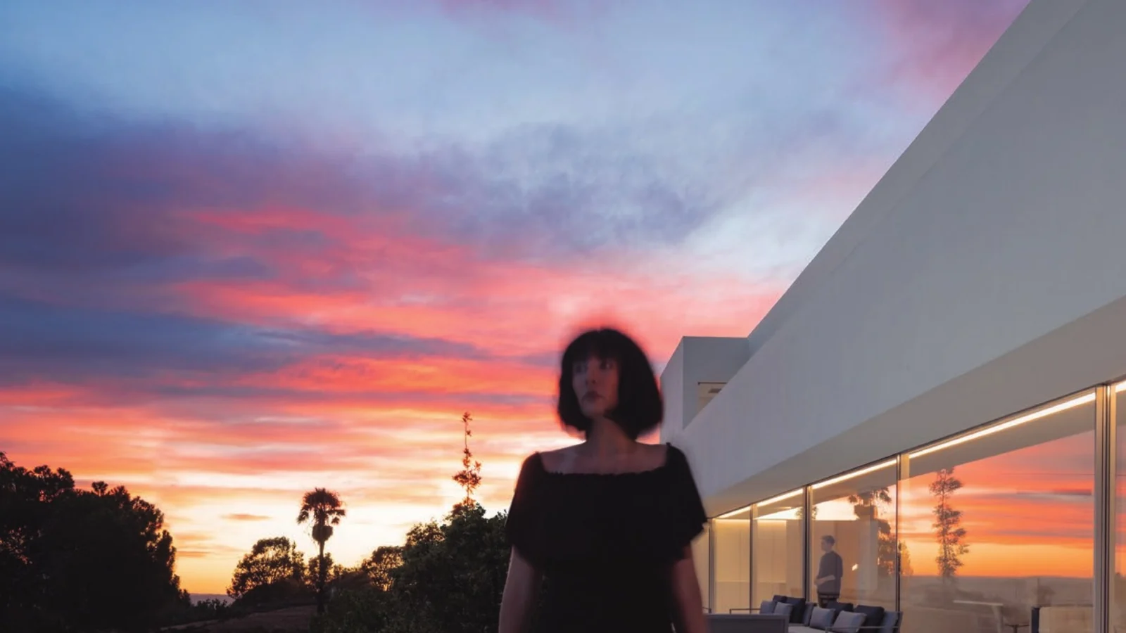Casa Santa Pola at dusk, seen across the pool through a full-height Sosoares OS minimalist sliding wall
