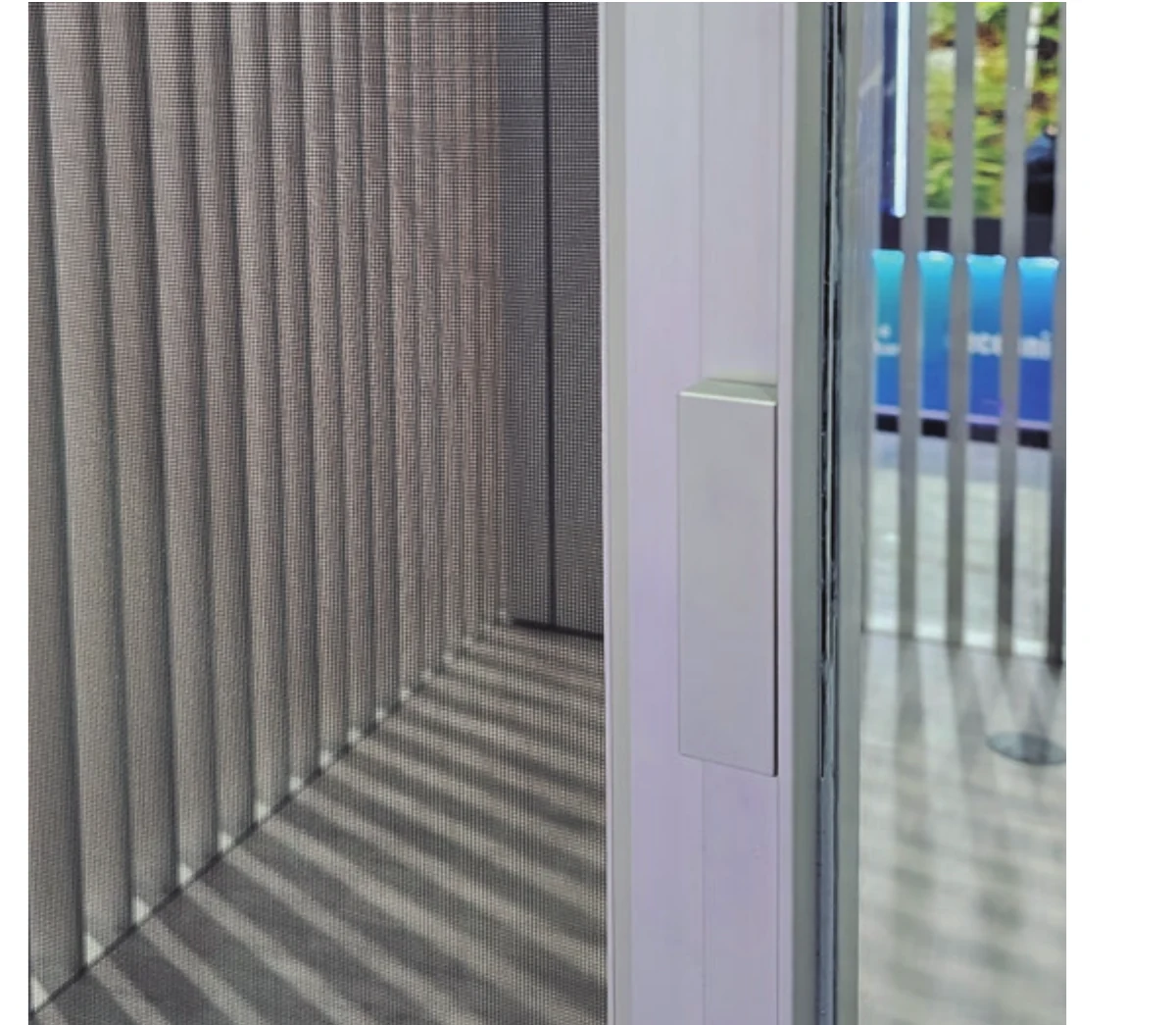 Installed detail of the Sosoares integrated insect screen drawn across an OS sliding opening